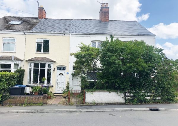 Pair of cottages appearing in auction