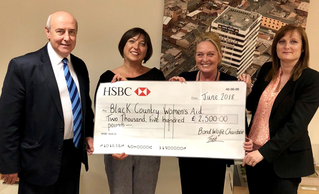 BCWA Three people holding a Cheque