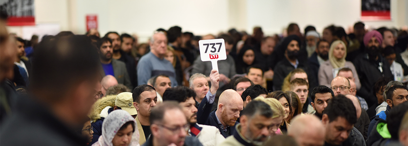 People bidding at a property auction West Midlands - Bond Wolfe