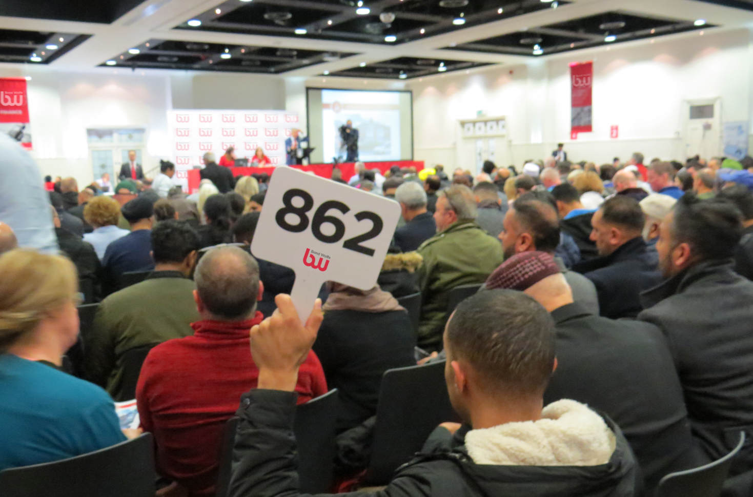 People bidding on a property auction West Midlands - Bond Wolfe